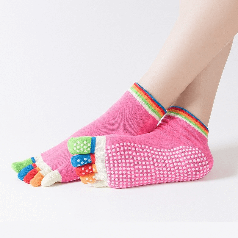 Colorful women's five-toe socks with non-slip grip, ideal for yoga and sports activities, providing comfort and quick-drying performance.